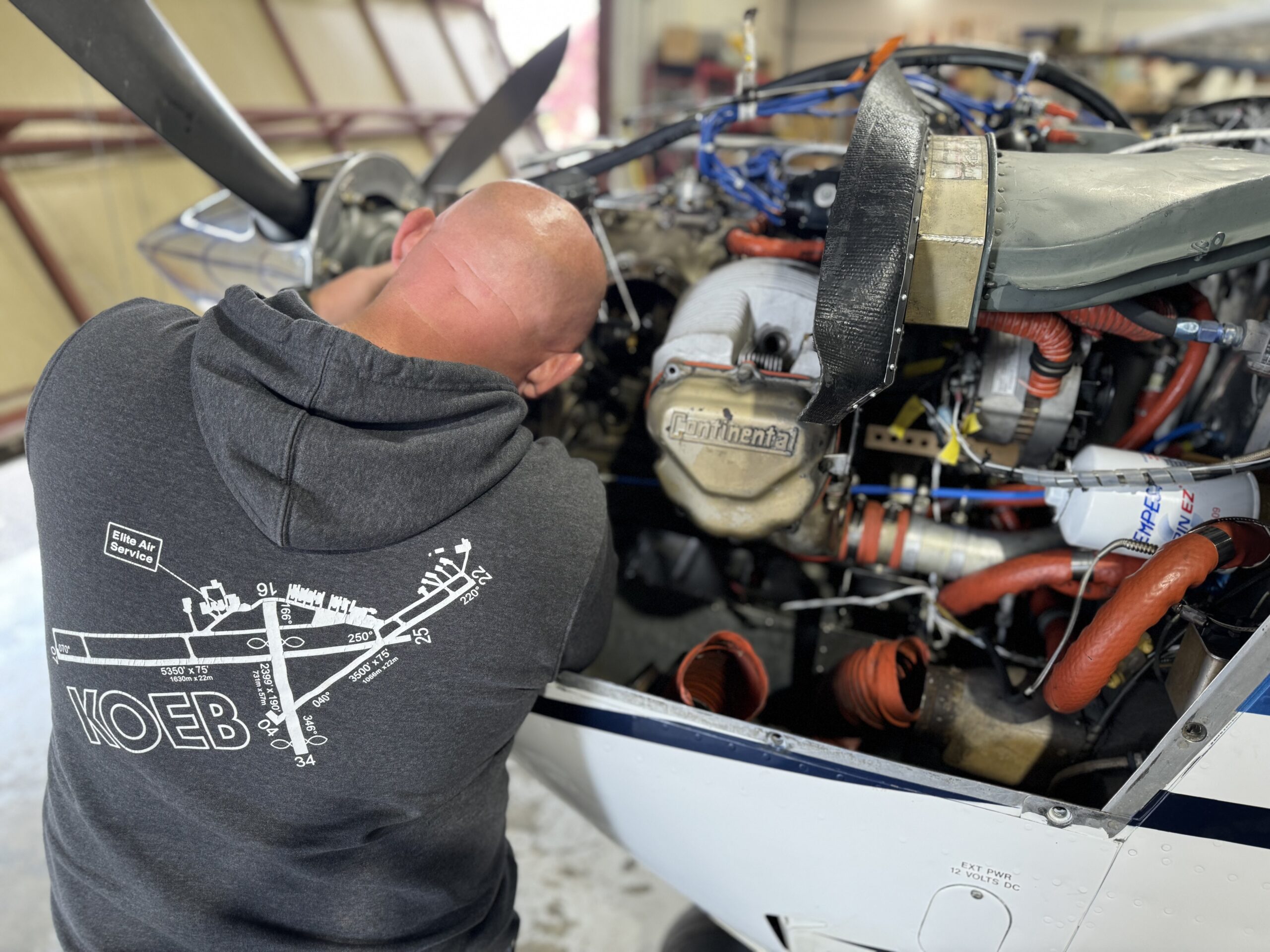 a EAS technician services an aircraft engine